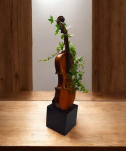 Alternative view of Violon sculpture with kintsugi and living plants