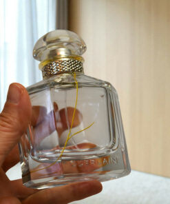 Alternative view of Guerlain perfume bottle with gold scares