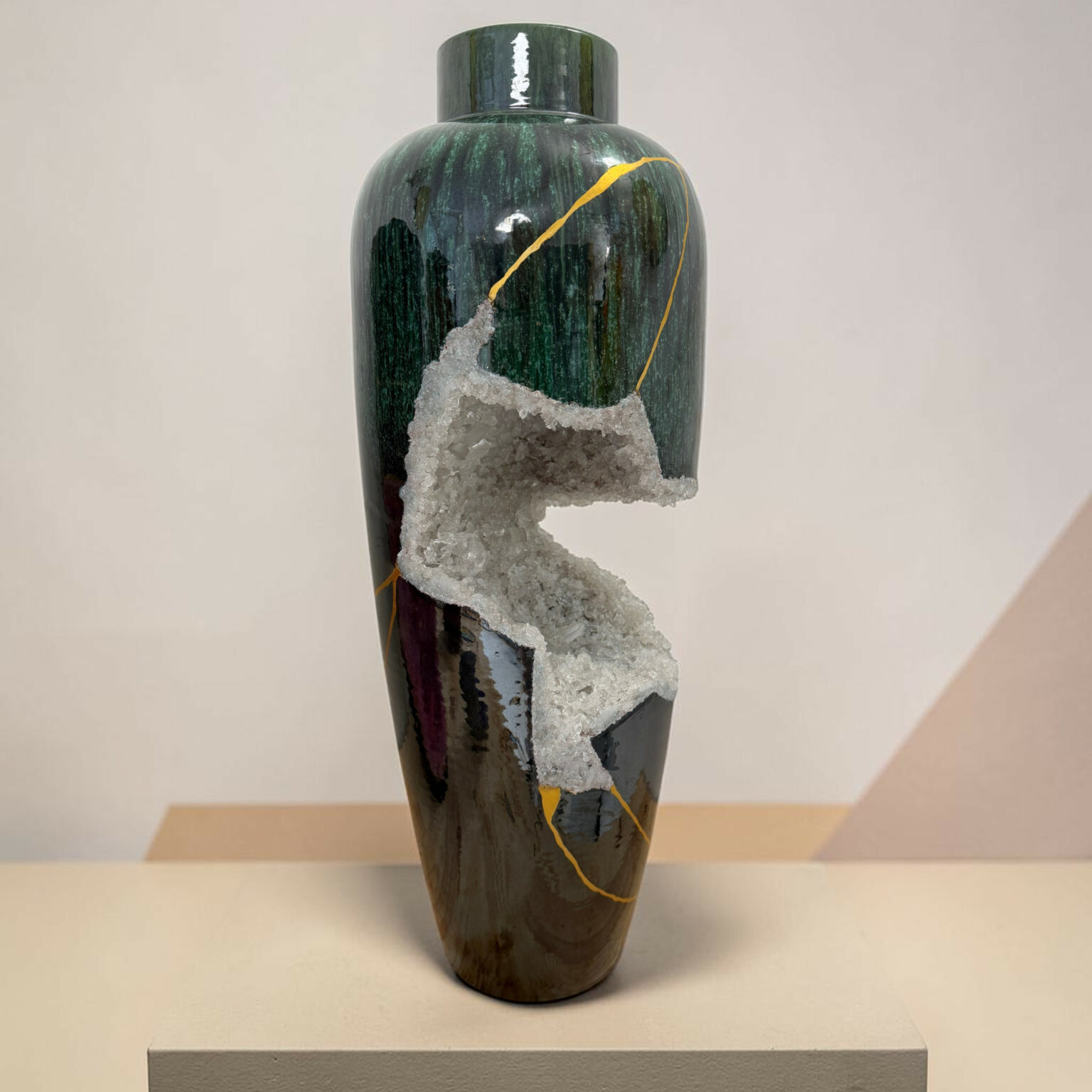 Dark green glazed vase with a gold vein and rough crystalline crust, displayed on a pedestal.